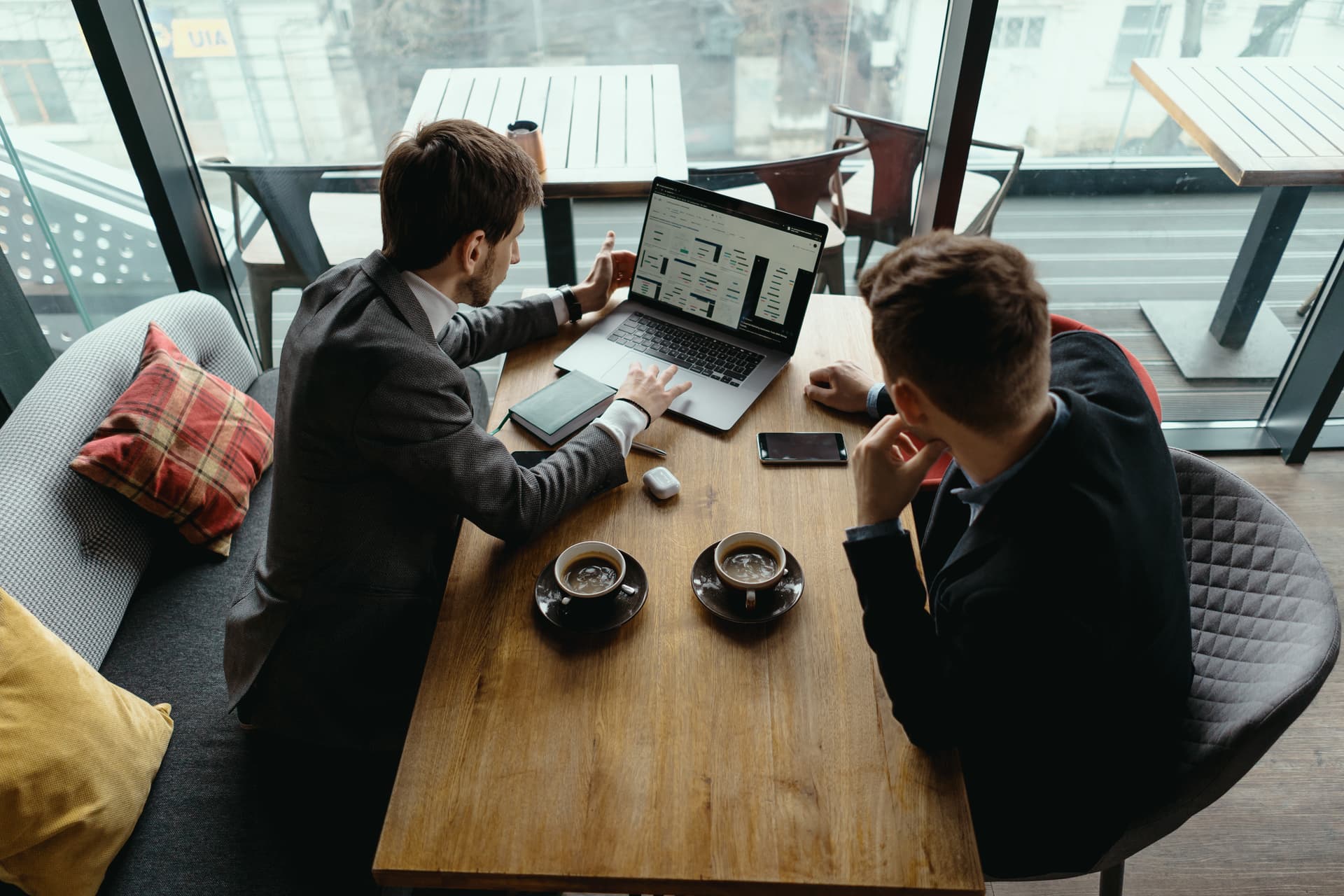 Two professionals in consultation meeting discussing business strategy